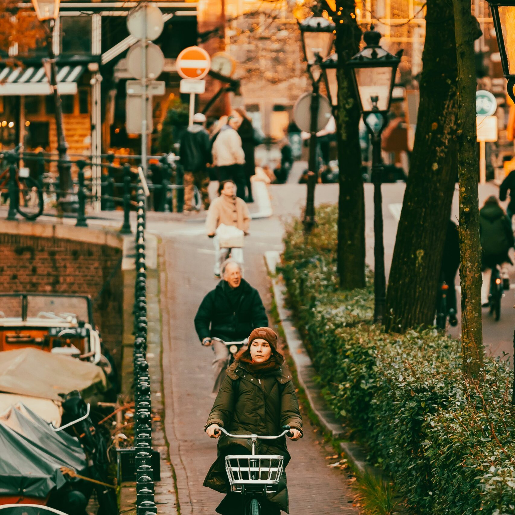 a person riding a bike down a street